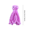 A fluffy pink octopus plush toy with large eyes.