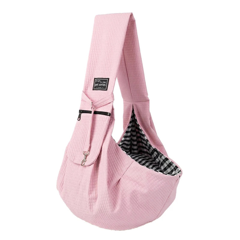 Pink crossbody pet carrier bag for dogs and cats with a plaid fabric lining