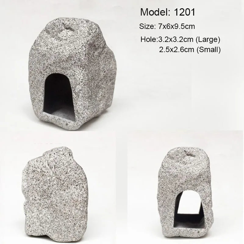 A gray ceramic cichlid cave aquarium decor piece with a natural, rough texture.