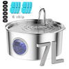 Stainless steel pet water fountain with six replacement chips and a pump visible.
