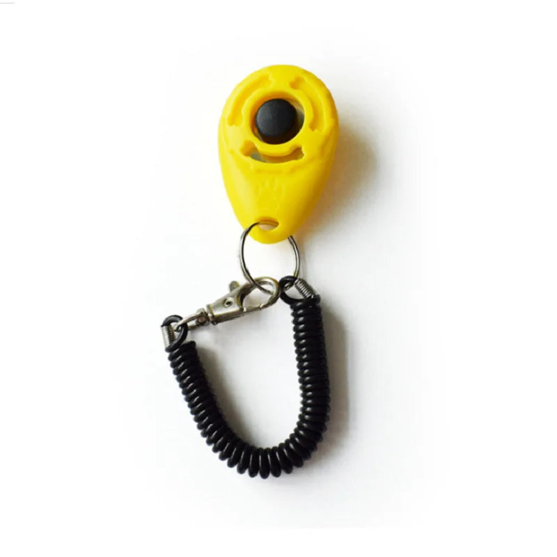 Gelber Hundetrainer-Klicker mit schwarzem Knopf und Metallarmband.