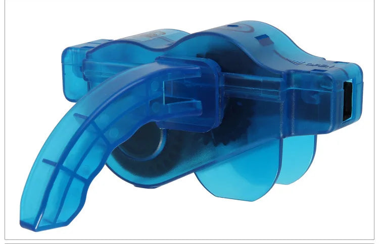 A blue bike chain cleaner tool featuring a curved brush and a clamp for cleaning bicycle chains.
