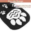Black knitted dog socks with a white paw print design and non-slip grip