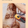 A person is using a yellow cordless pet grooming clipper on a dog's fur.