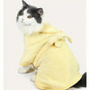 A fluffy white and gray cat wearing a yellow absorbent quick-dry pet bathrobe.