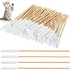 A collection of long cotton swabs for pet ear cleaning, including wooden sticks and white cotton tips.