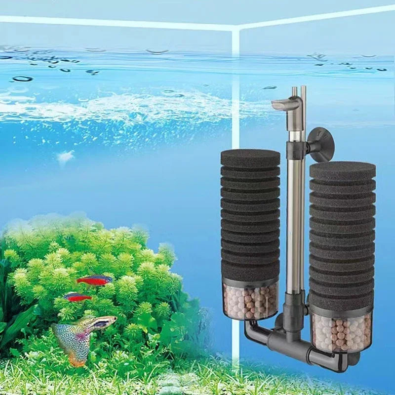 A black and silver aquarium bio sponge filter with a surface skimmer is shown in a natural outdoor setting.
