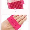 A pink rubber pet grooming brush with a floating wool attachment and an adjustable elastic fastener.