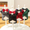 Five dog tuxedo costumes in various colors and styles displayed on white mannequins.