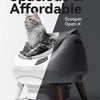 A gray cat is positioned on a white automatic litter box, with text advertising spacious and affordable options.