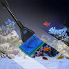 A black aquarium cleaning tool with a blue cleaning pad and a handle is shown in an underwater environment.