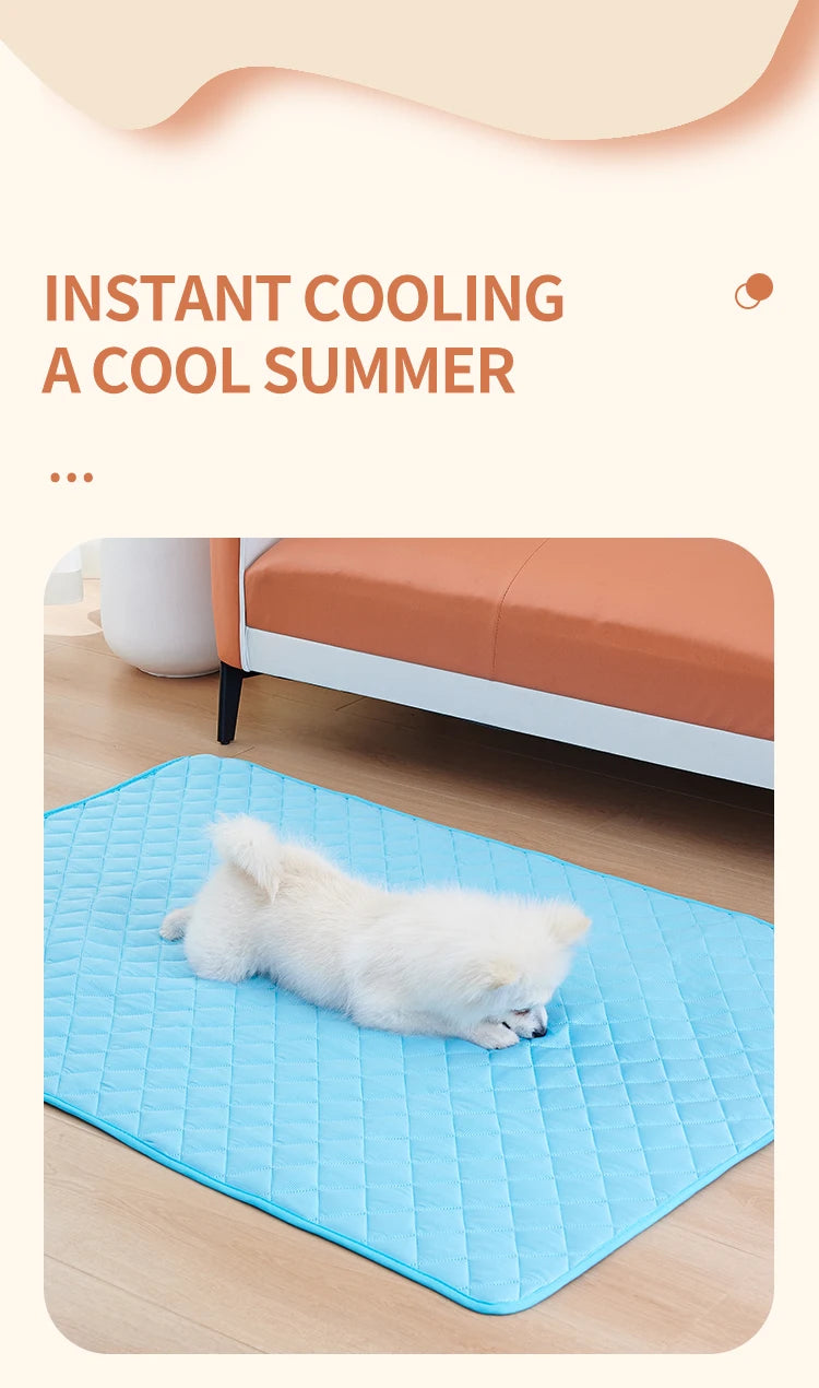 A light blue quilted dog mat is shown on a wooden floor next to a bed.