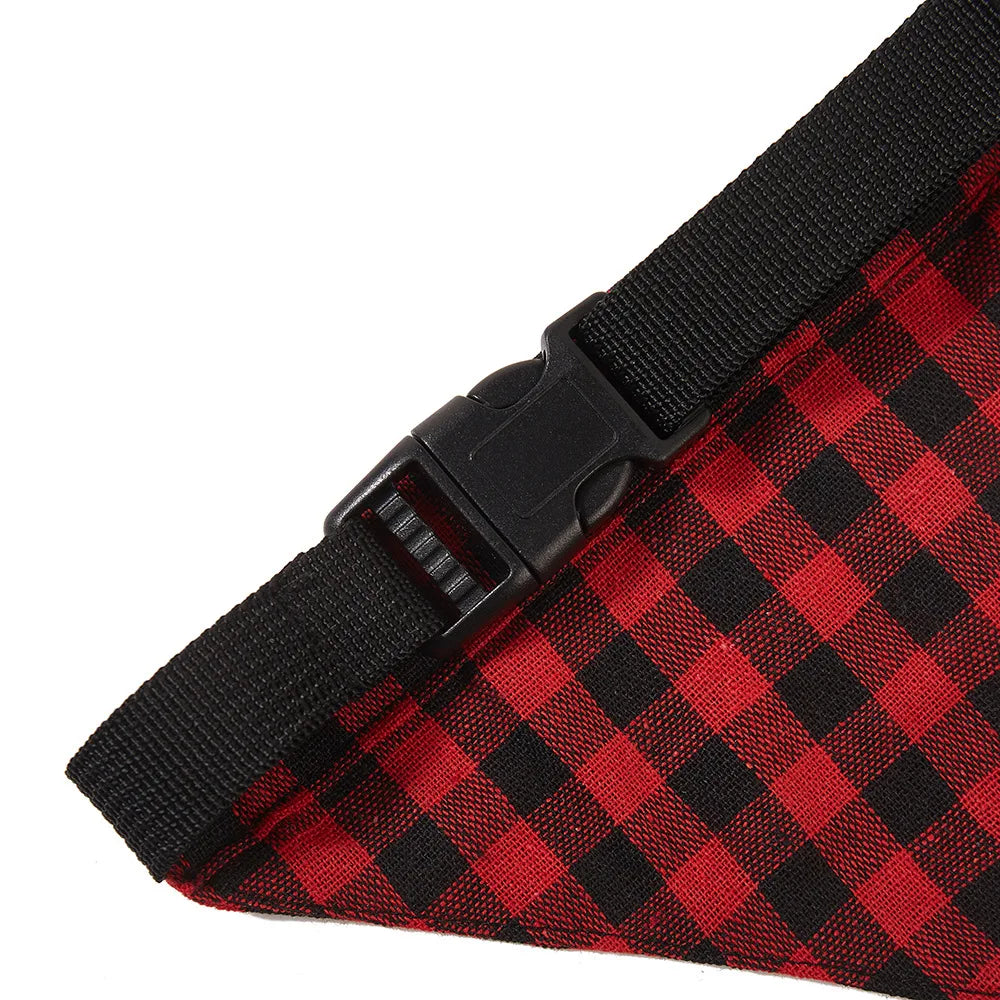 A close-up view of a red and black plaid bandana or scarf for pets.