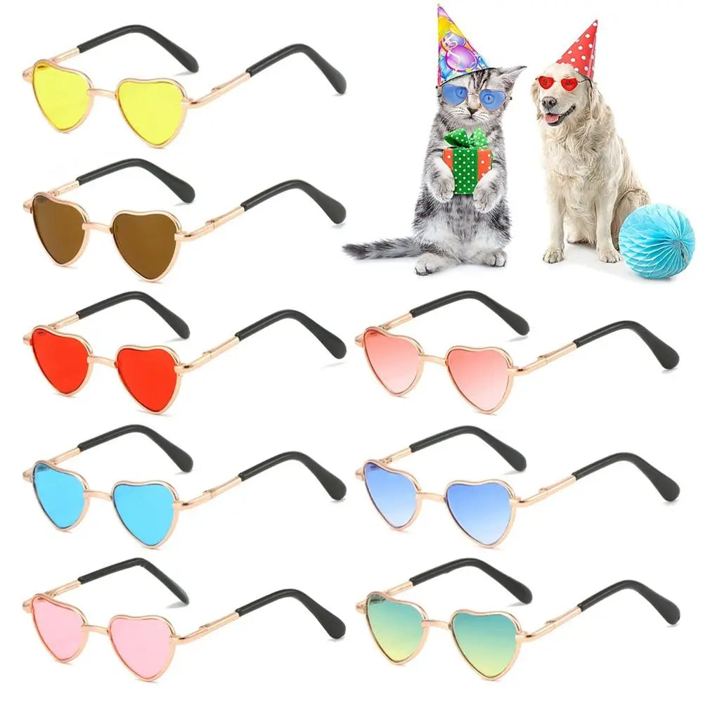 A collection of funny heart-shaped pet sunglasses for cats and dogs in various colors and designs.