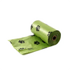 Paquets de sacs pour excréments de chien verts avec des empreintes de pattes noires pour le nettoyage extérieur