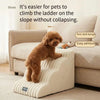A small brown dog is climbing a beige pet safety ladder designed for easy admission and anti-slip grip.
