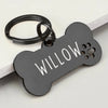Black bone-shaped stainless steel dog ID tag engraved with the name Willow