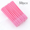 A bundle of 50 pink disposable eyelash and eyebrow brush sets.