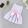 A pink and white striped bow dress for a small pet, featuring a large pink satin bow.
