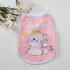 Pink sleeveless vest for pets featuring a dinosaur design with a crown and a smiling face