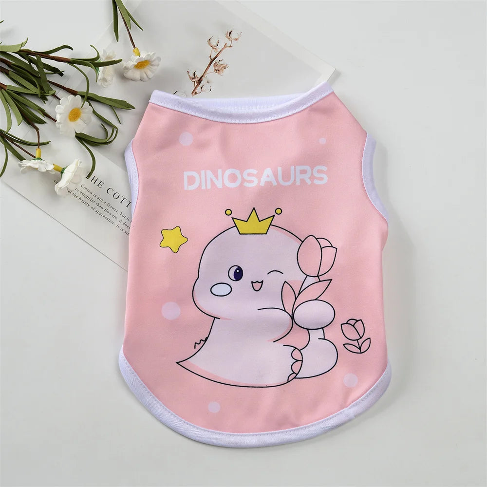 Pink sleeveless vest for pets featuring a dinosaur design with a crown and a smiling face
