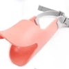 A pink adjustable silicone duckbill dog muzzle with a gray strap is shown against a white background.