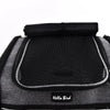 A black ventilated bird travel backpack with a padded top and mesh interior.