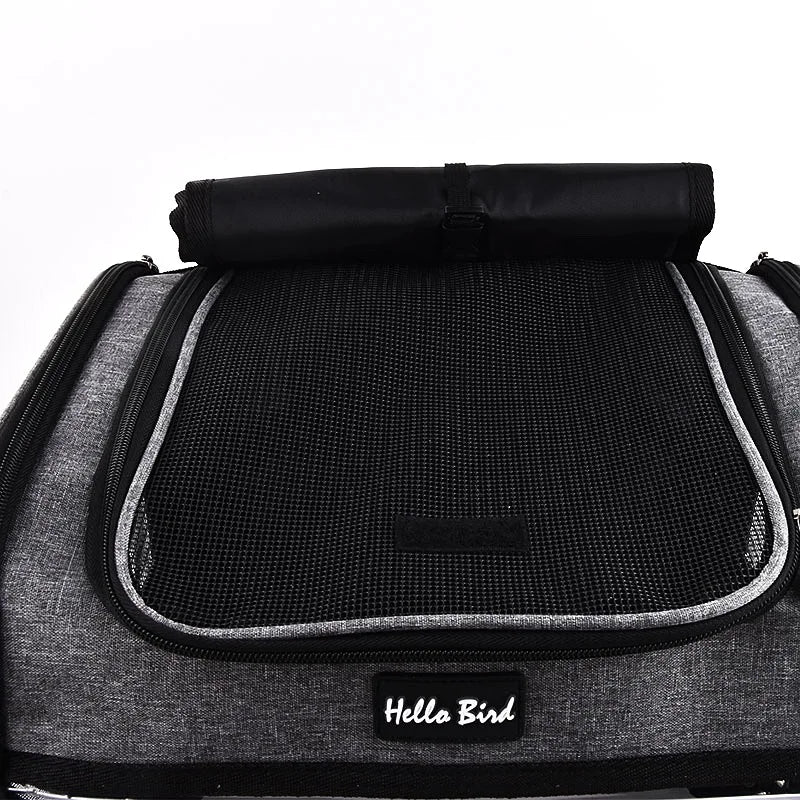 A black ventilated bird travel backpack with a padded top and mesh interior.