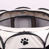A white and black portable foldable pet playpen with a mesh enclosure and paw print design.