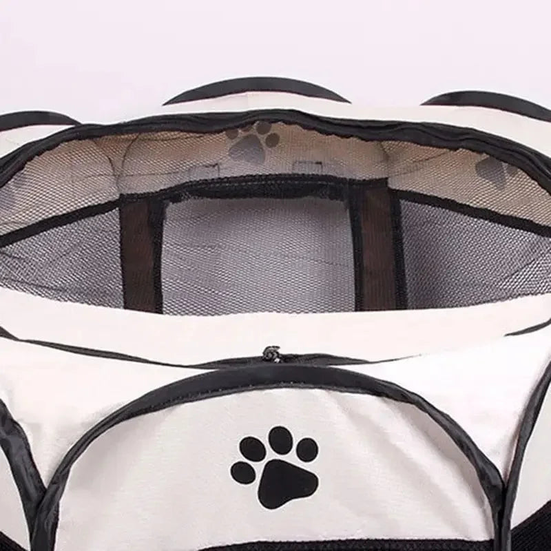 A white and black portable foldable pet playpen with a mesh enclosure and paw print design.