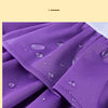 Close-up of a purple waterproof fabric material showing water droplets on the cloth.