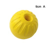 Yellow durable rubber fetch ball for dogs with a hole, shown from above.