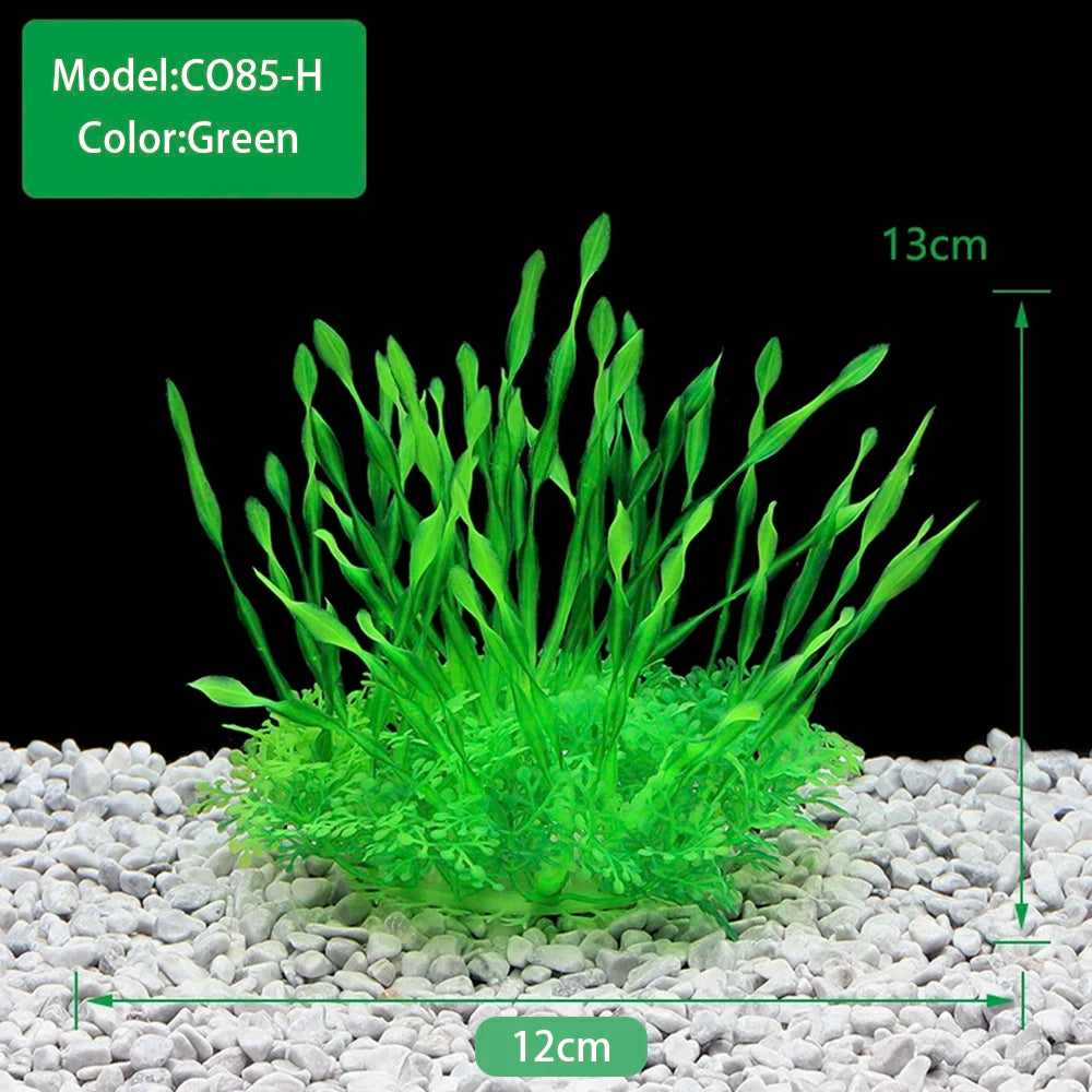 Green artificial aquarium plants growing in white gravel