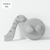 A gray silicone pet can opener and feeding spoon with a sealing lid.