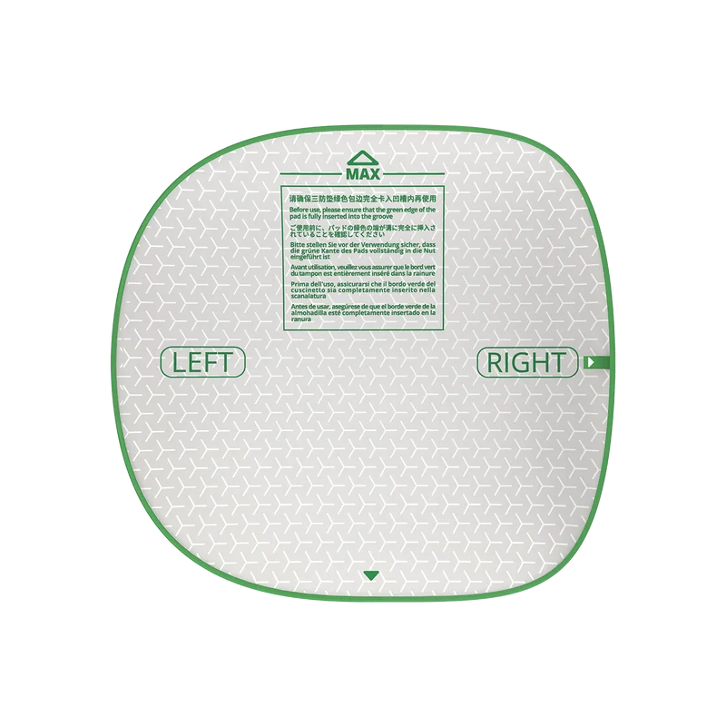A replacement litter mat with directional arrows labeled LEFT and RIGHT on a light green surface.