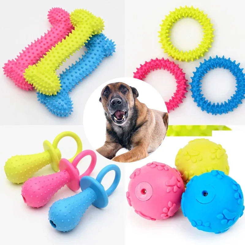 Assortment of colorful squeaky chew toys for dogs including rubber toys and a dog head shape.