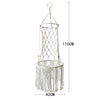 A bohemian macrame cat hammock bed for pet decor made of light-colored rope and fringe.