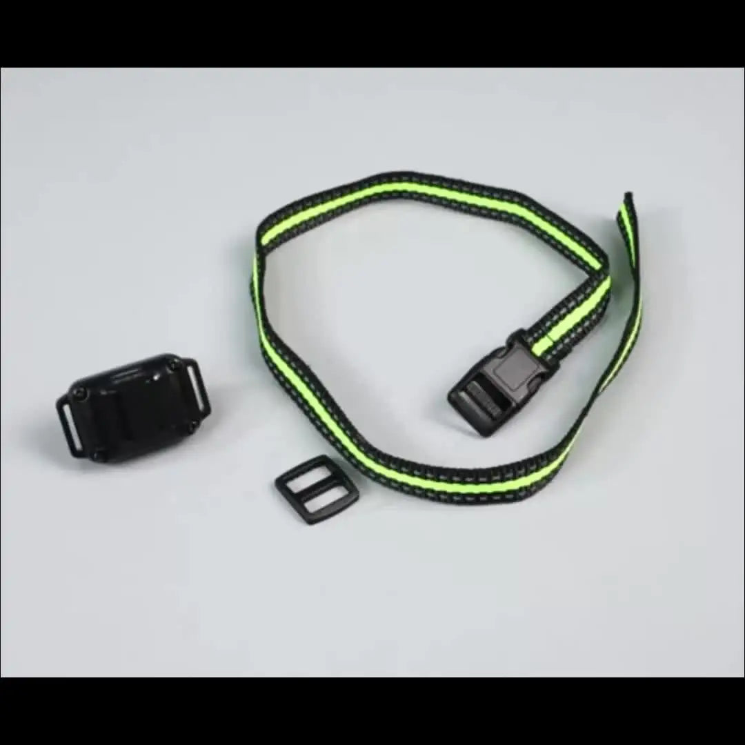 A black waterproof dog training collar with a neon yellow strap and a remote control is shown on a white background.