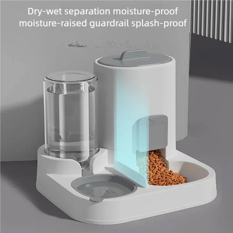 A white automatic pet feeder and water dispenser unit with a clear water reservoir and dry-wet separation features.