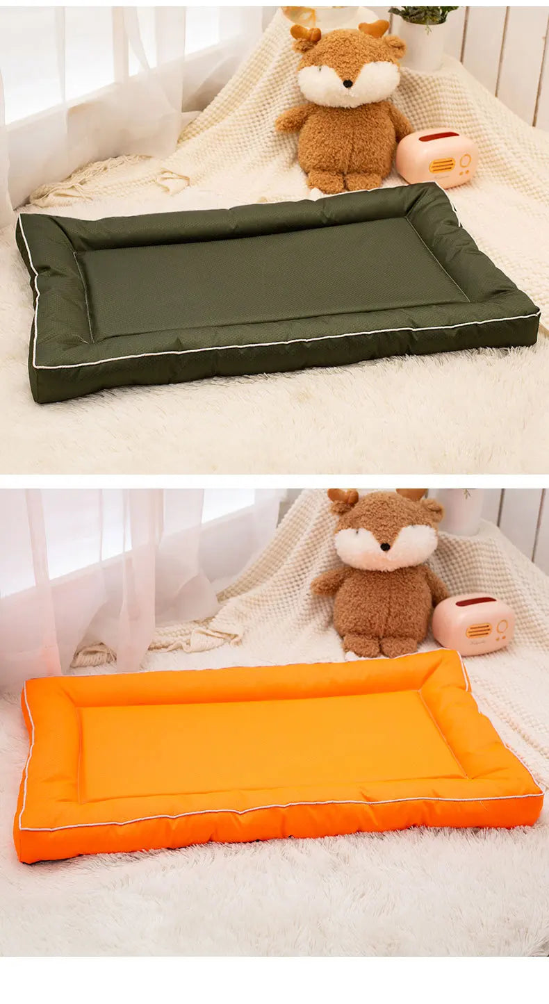 Two pet mats, one olive green and one orange, are shown next to a stuffed animal.
