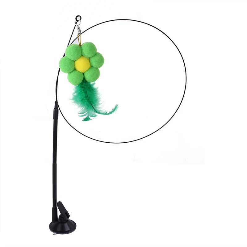 Interactive cat teaser wand featuring a green flower, feather bird, and bell.