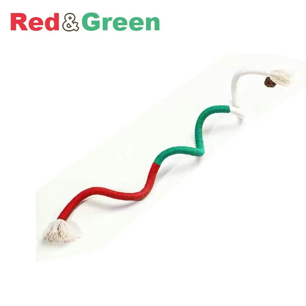 A red and green cotton rope toy with tassels, used as an interactive cat teaser.