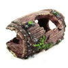 Resin broken barrel fish tank decoration with moss, showing a weathered brown texture.
