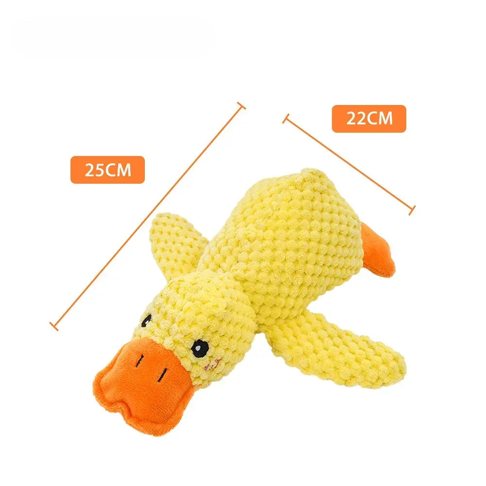 Yellow plush duck toy with an orange beak and feet, shown next to measurement lines.