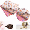 A stack of soft fleece pet bed mat covers for cats and dogs, shown next to a dog.