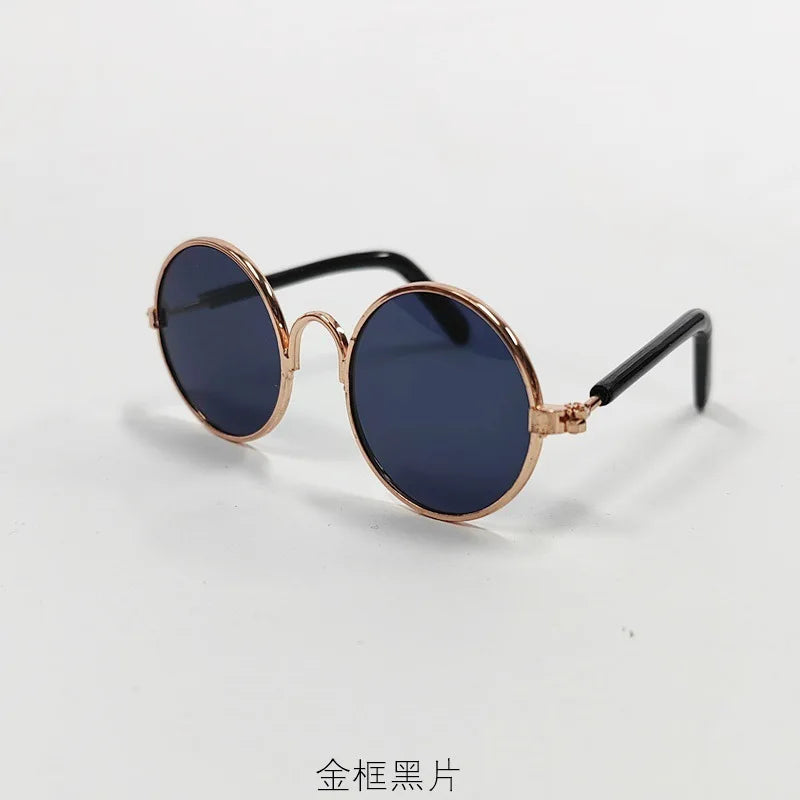 Gold-toned metal frame round sunglasses with dark blue lenses