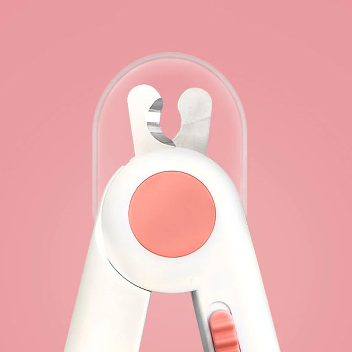 A close-up view of a white pet nail clipper with a pink light and silver metal components against a pink background.