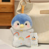 A small, soft blue and white cartoon penguin bean bag plush toy is displayed next to a beige canvas bag.