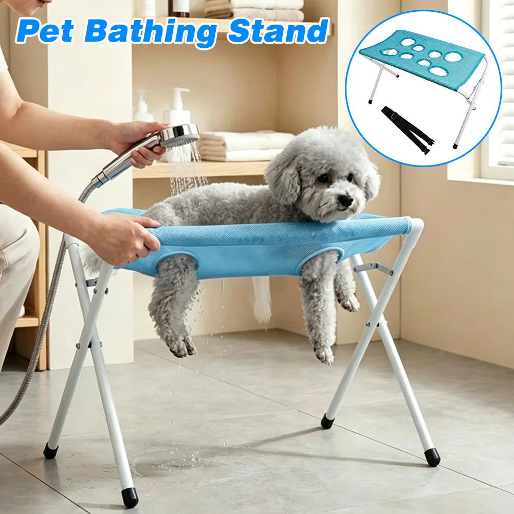 A person is using a pet bathing stand to bathe a small, fluffy dog.