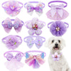 A collection of purple and pink lace bowtie collar accessories for small dogs and cats.